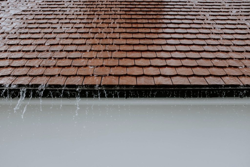 Water rushing from roof during cleaning
