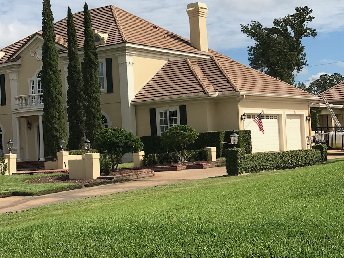 Residential home after Roof Cleaning in Sanford, FL with a clean and refreshed roof surface