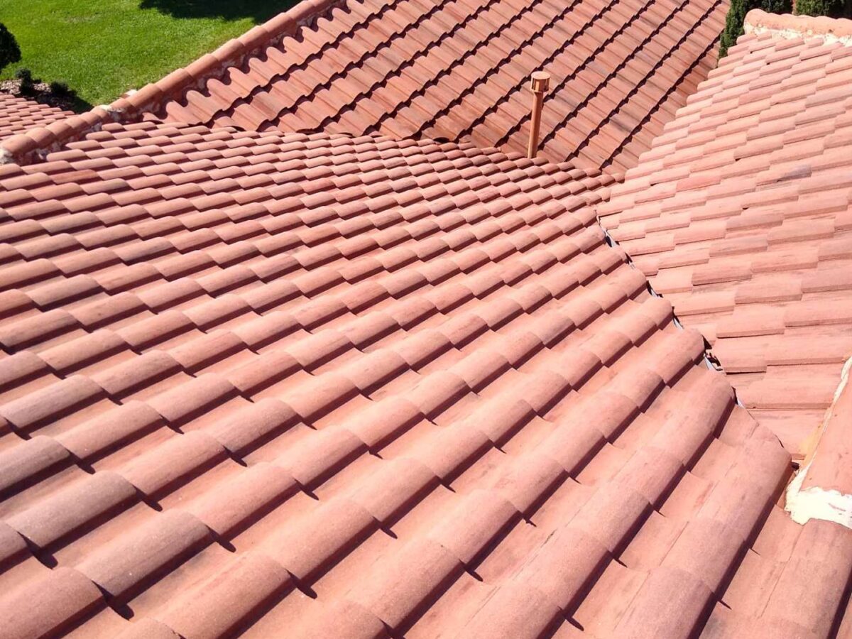 Before and after view of Roof cleaning near me in Orange City, FL on a shaded home exterior
