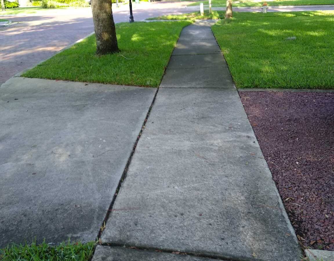 Front entrance before Maintenance Cleaning in Celebration, FL with clean walkways and exterior surfaces Front entrance before Maintenance Cleaning in Celebration, FL with clean walkways and exterior surfaces