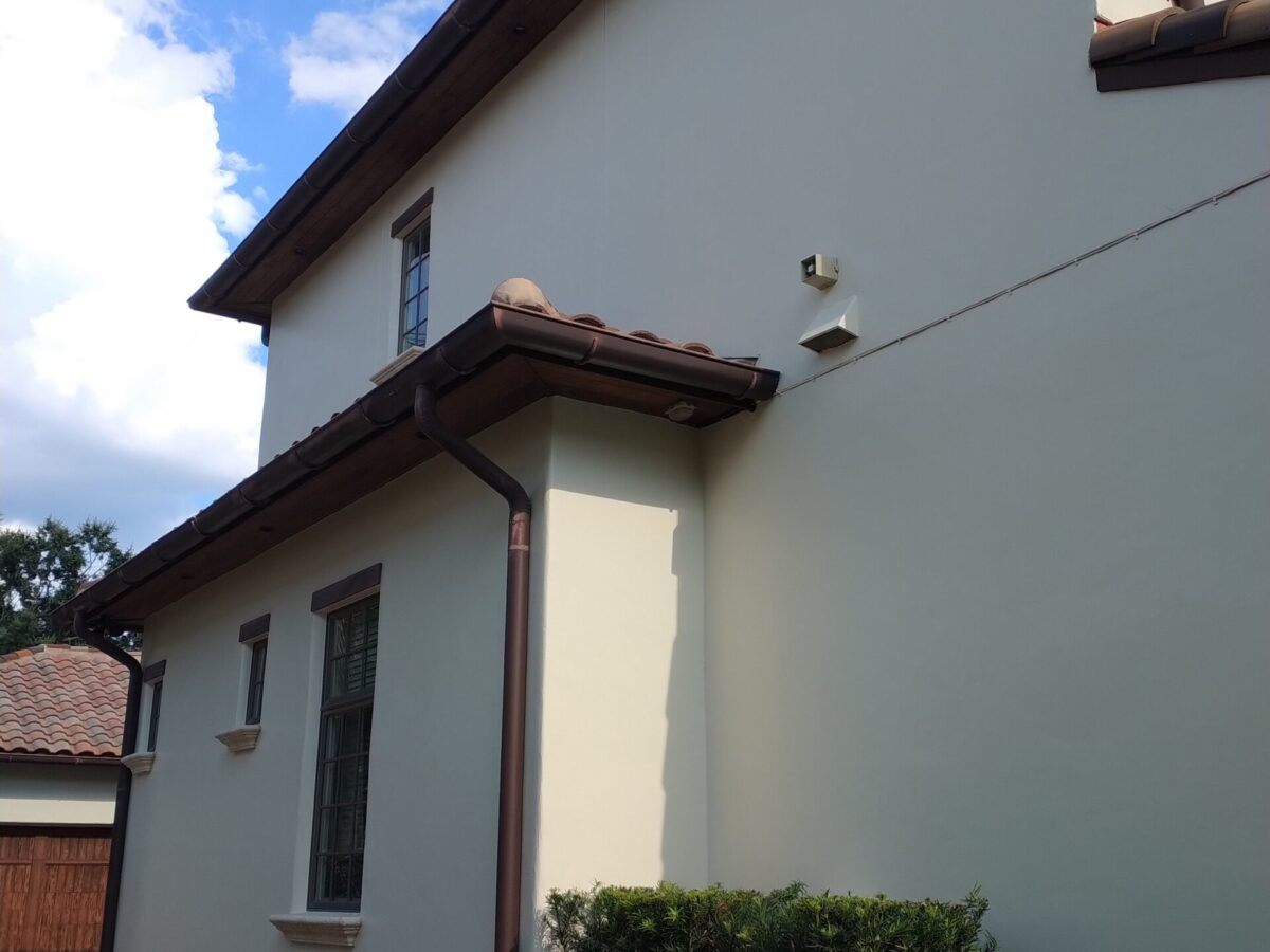 Home exterior receiving maintenance cleaning near me in Winter Springs, FL with spotless walkways and decorative pavers