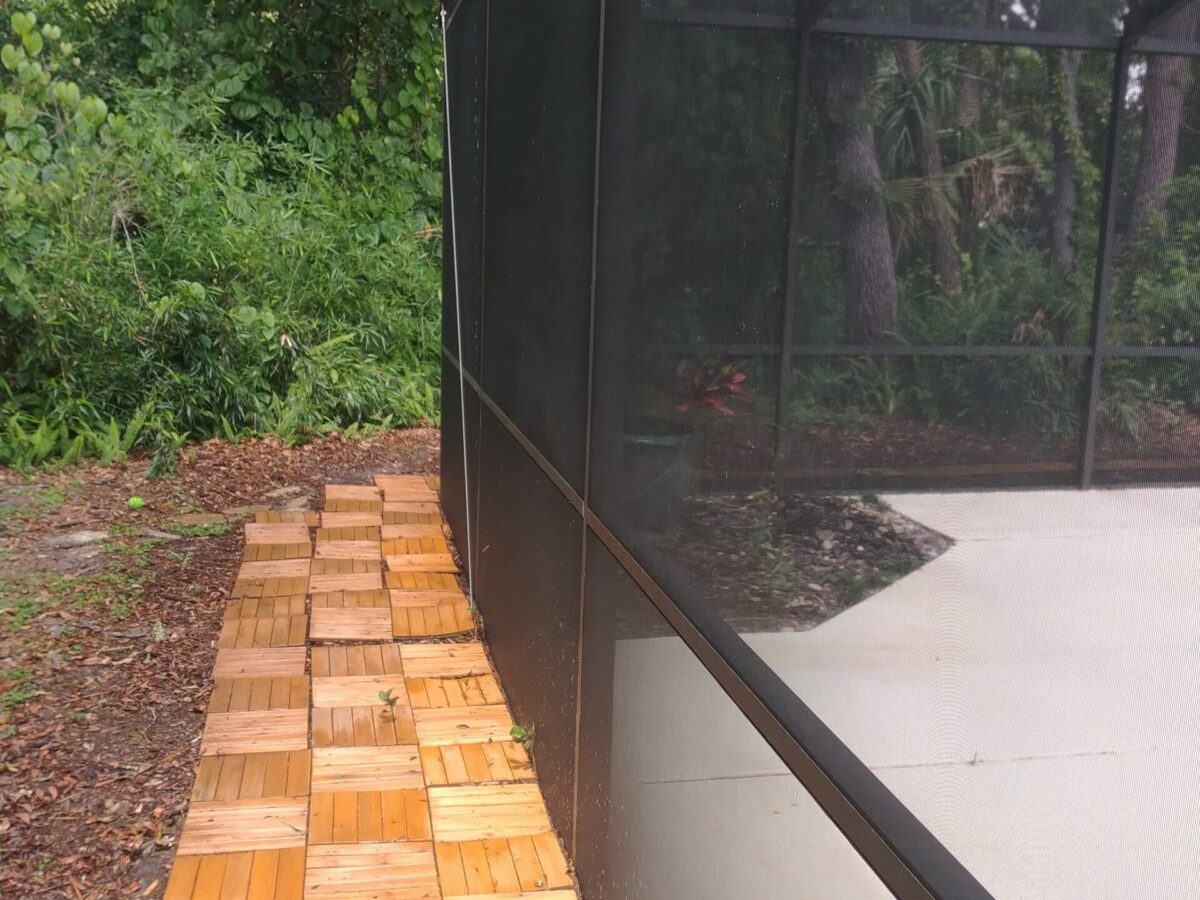 Character-style home refreshed after Maintenance Cleaning in DeLand, FL with a clean porch and defined brick walkway