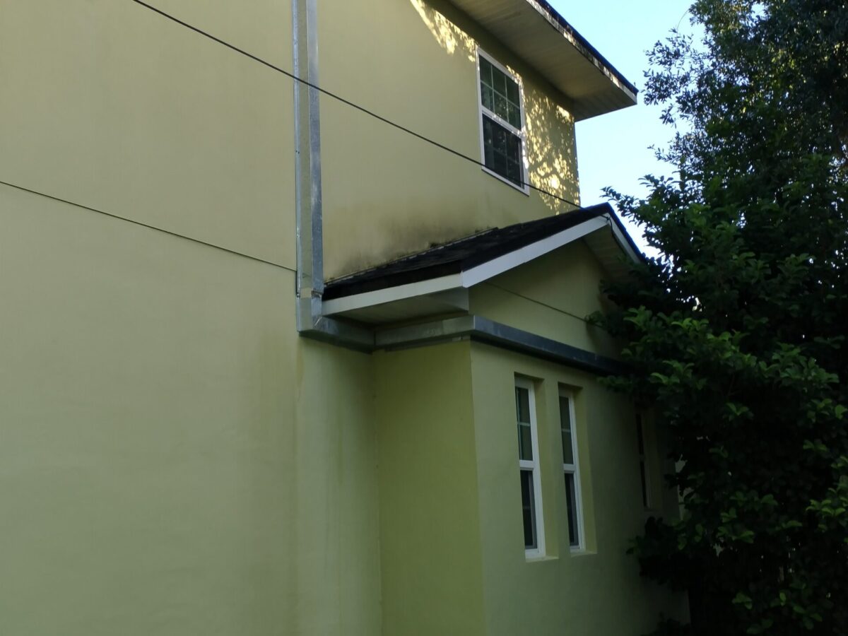 Educational property after Exterior Building Cleaning in DeLand, FL with refreshed covered walkways and exterior walls