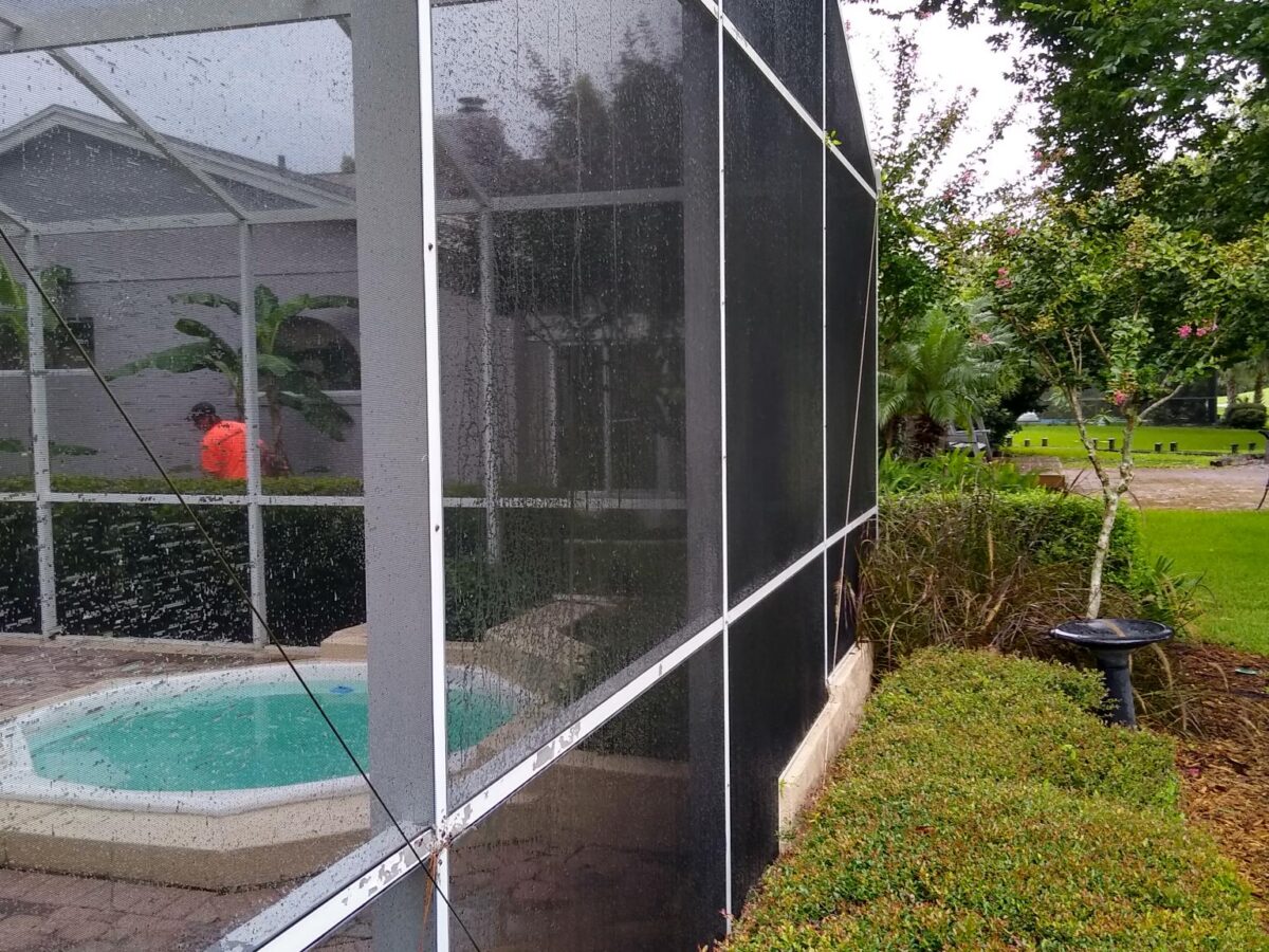 Professional exterior building cleaning near me in Oviedo, FL removing visible pollen residue around a landscaped office property Professional exterior building cleaning near me in Oviedo, FL removing visible pollen residue around a landscaped office property